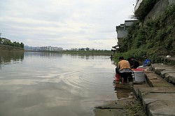 women who are washing their clothes by the river