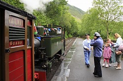 people and the old train at the platform